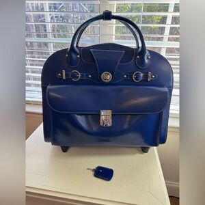 McKlein Laptop Bag/tote with wheels and extendable handle.